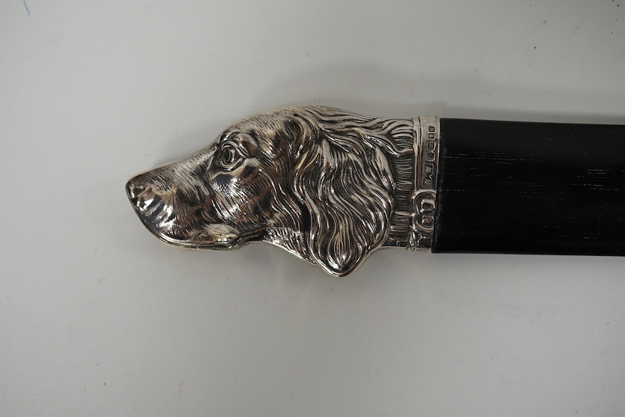 A modern silver mounted wooden paper knife with dog's head finial, London, 2004, 25.6cm. Condition - good